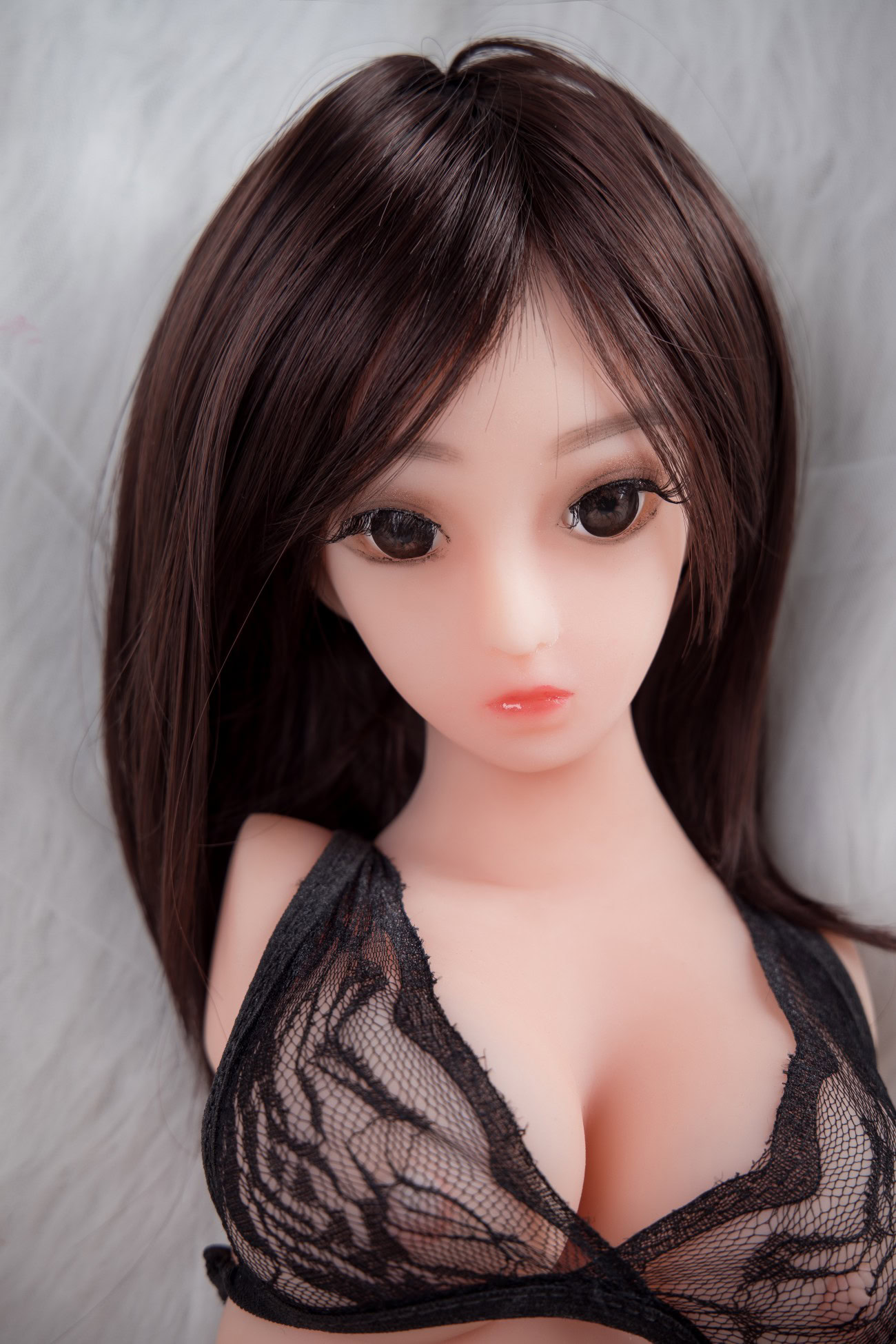 Realistic love doll with brown hair and black lace lingerie for Yetta collection.
