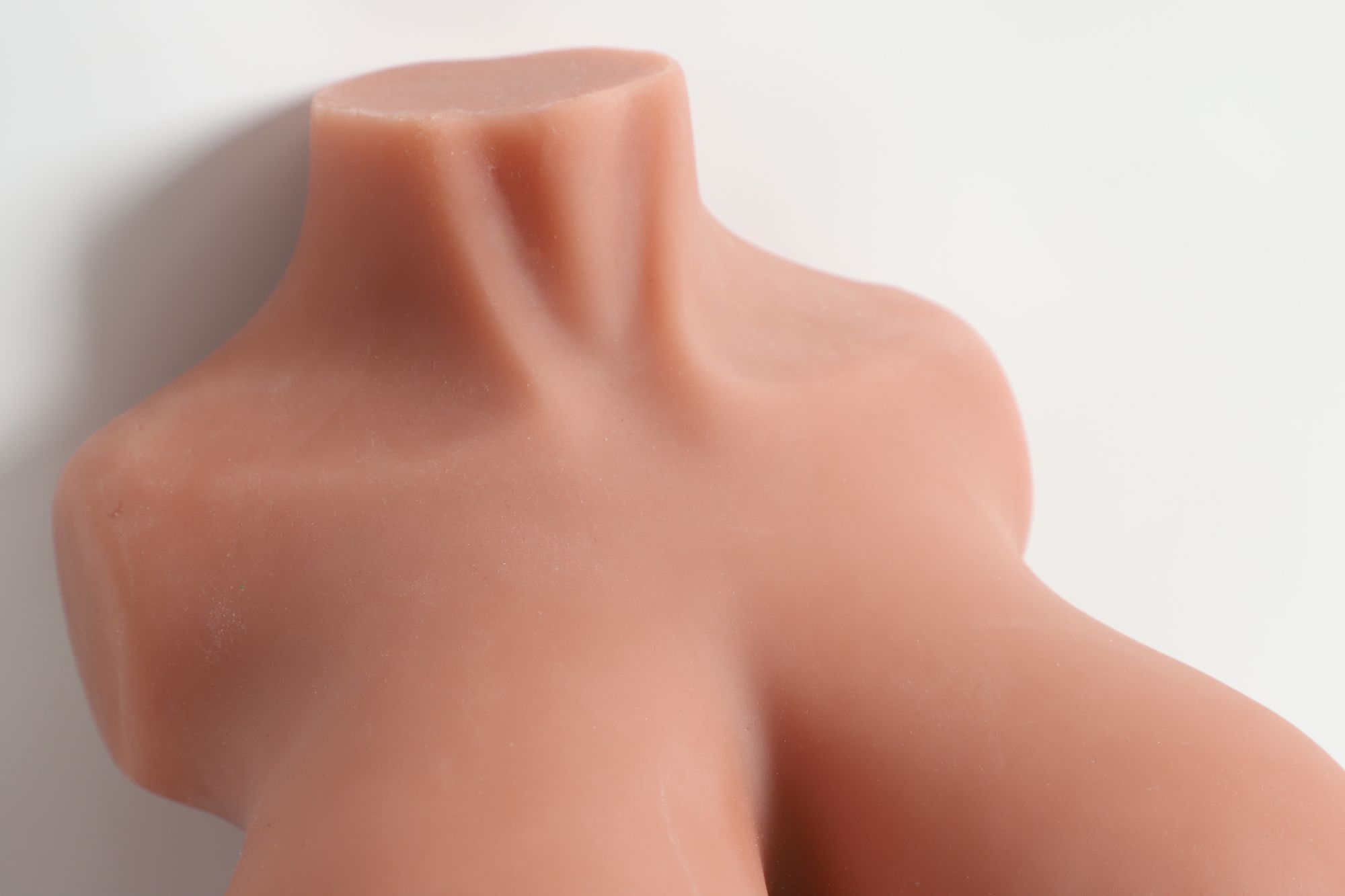 Four channel sex doll torsos1 Realistic torso of a sex doll with detailed skin texture and natural shape.